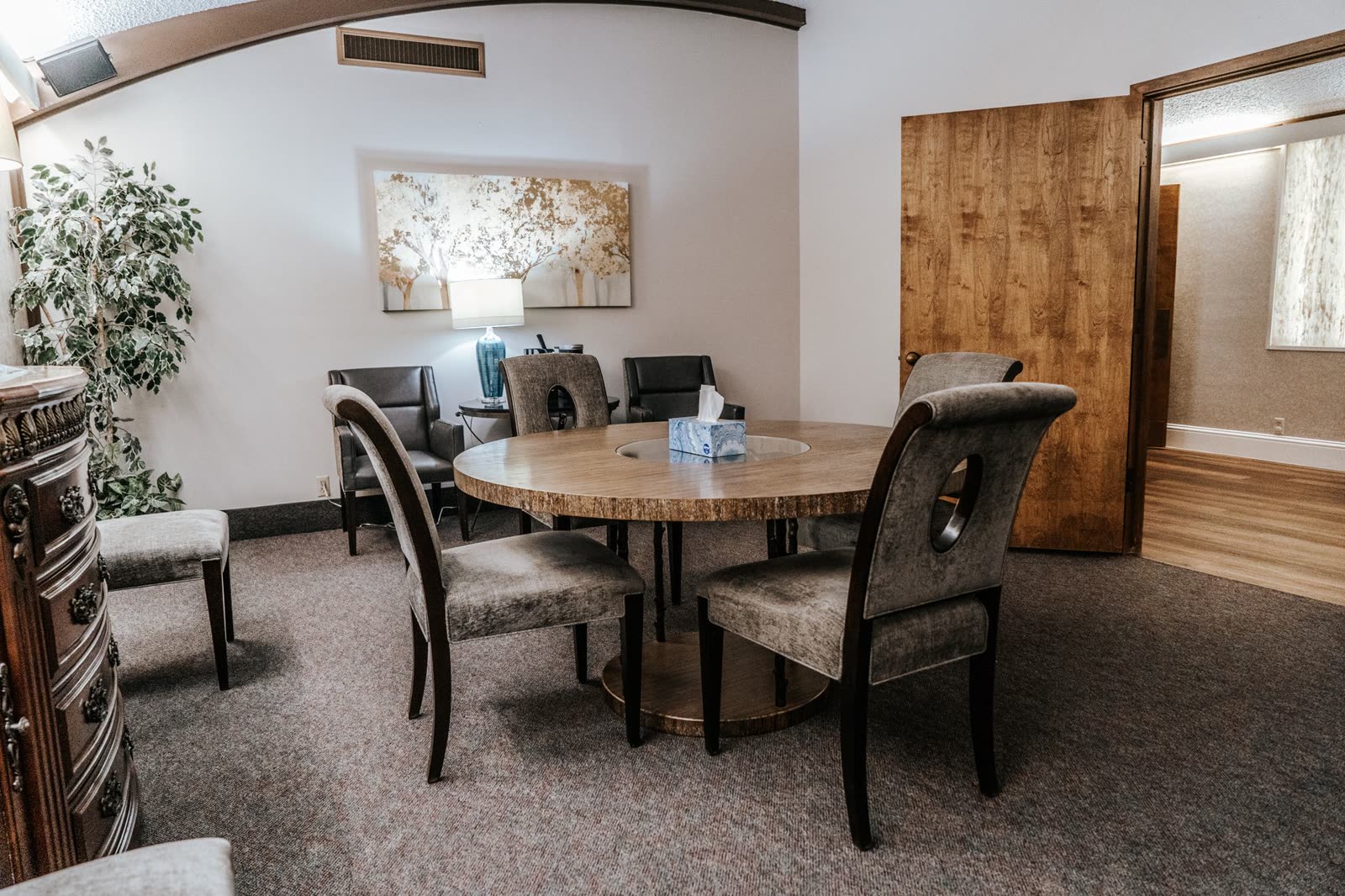 The arrangement conference room, with a round table and upholstered chairs
